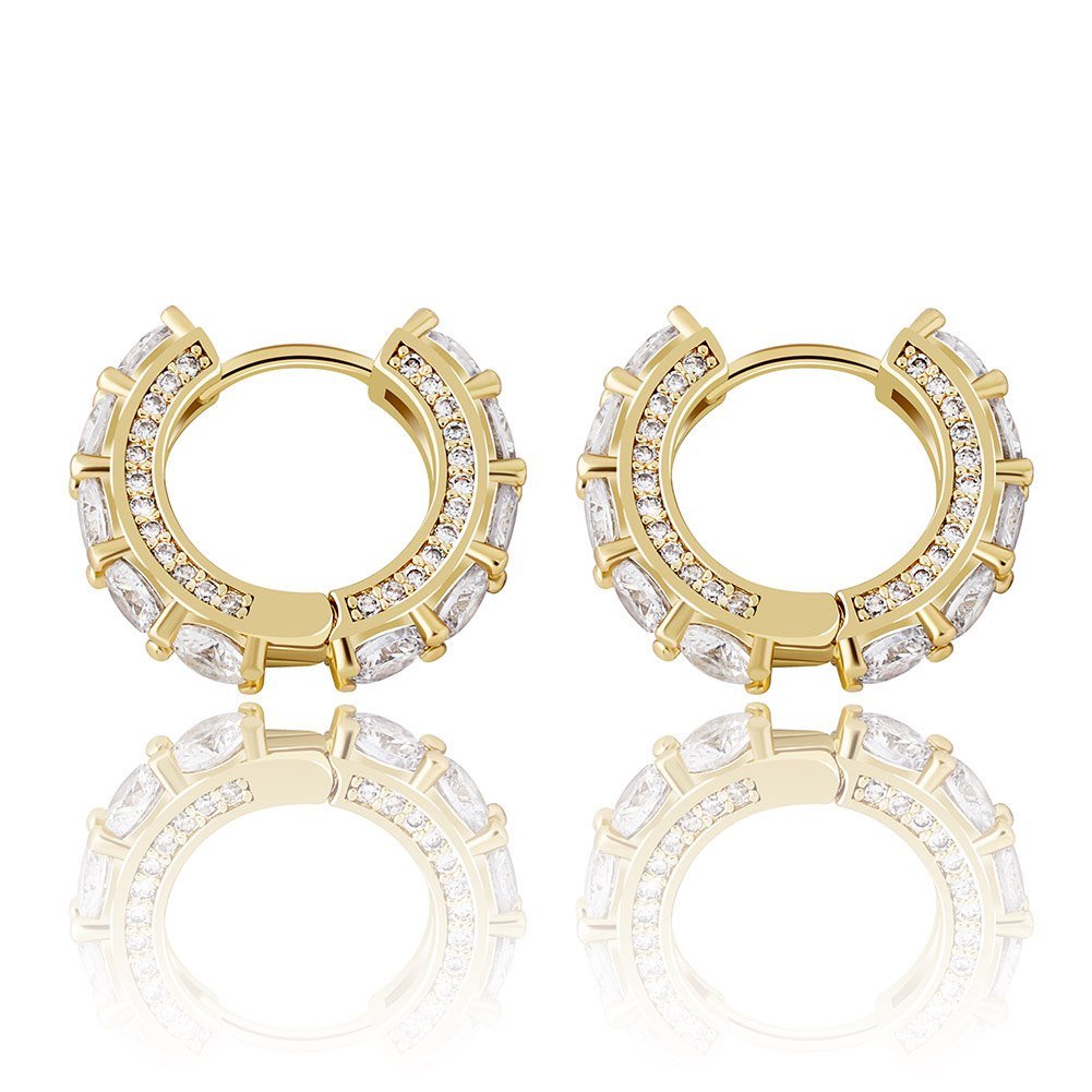 How to Wear Huggie Earrings: Fit, Stacking & Styling Tips 2 Gold tone CZ huggie hoop earrings seen from the front, with round cubic zirconia stones all around the hoop