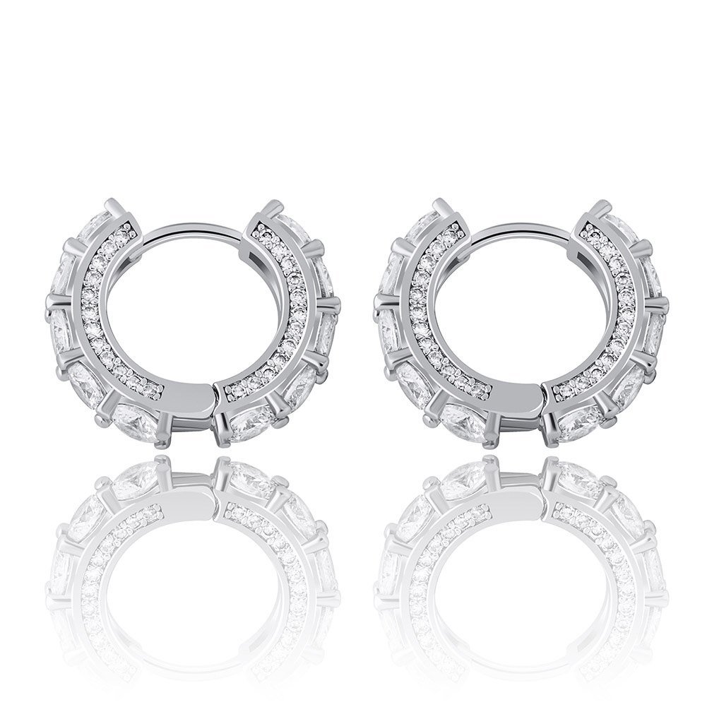 How to Wear Huggie Earrings: Fit, Stacking & Styling Tips 4 Silver tone CZ huggie hoop earrings seen from the front, round cubic zirconia stones set along the hoop